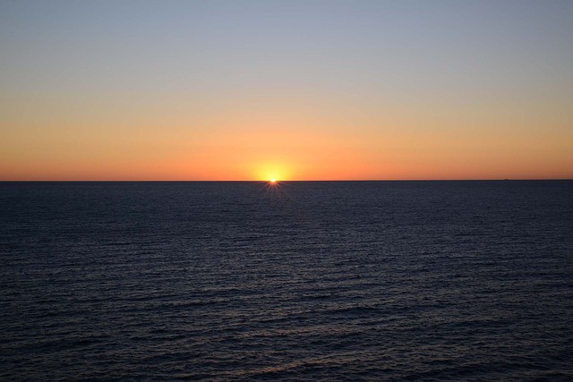 sunrise-cloudless-ocean-orange