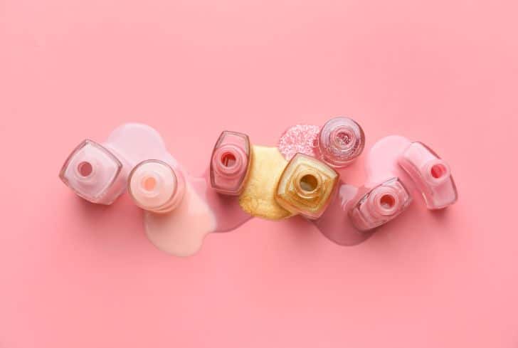 different-nail-polish-on-pink-background