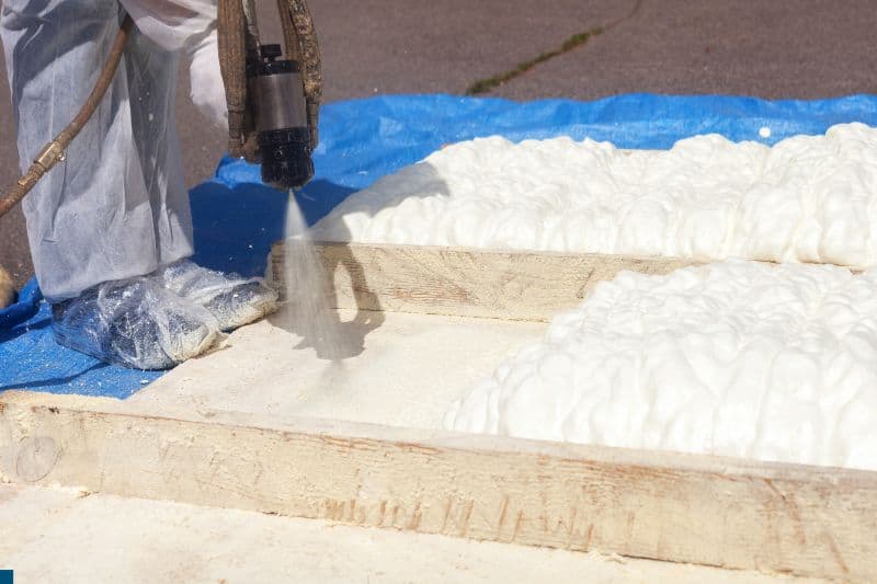man-spraying-foam-insulation